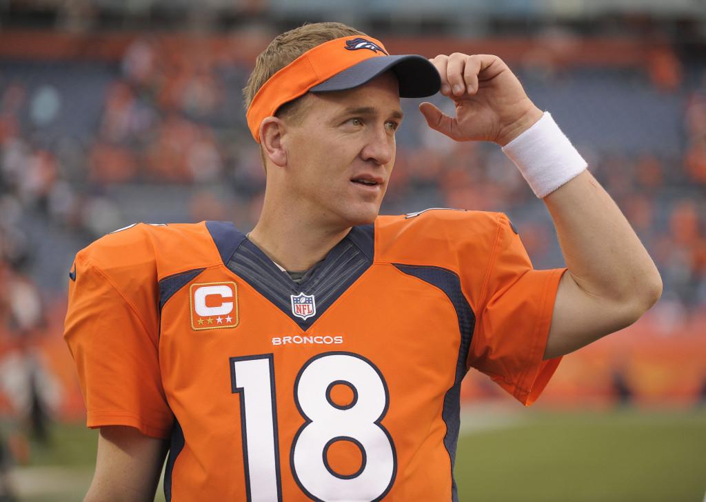 Denver Broncos quarterback Peyton Manning (18) watches play from the sidelines late in the fourth quarter against the Philadelphia Eagles in an NFL football game, Sunday, Sept. 29, 2013, in Denver. Denver won 52-20. (AP Photo/Jack Dempsey)