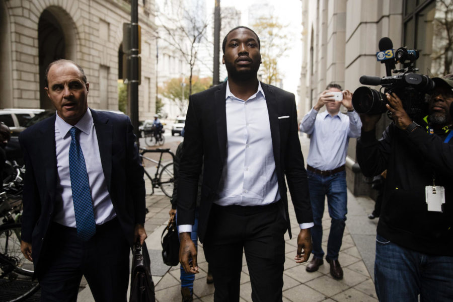 Rapper Meek Mill, center, accompanied by his defense attorney Brian Mcmonagle arrives at the criminal justice center in Philadelphia, Monday, Nov. 6, 2017. A Philadelphia judge has sentenced rapper Mill to two to four years in state prison for violating probation in a nearly decade-old gun and drug case. (AP Photo/Matt Rourke)