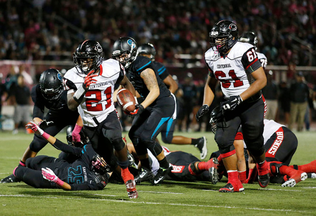Corona Centennial running back JJ Taylor (21) breaks away for a touchdown in the first half against Corona Santiago during the Big VIII League, CIF Southern Section football game, Friday, Oct. 24, 2014 in Corona, Calif. (Press-Enterprise/Doug Benc)