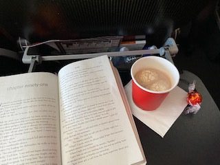 The above image is a picture I took of my hot chocolate and Lindt chocolate while on the flight.