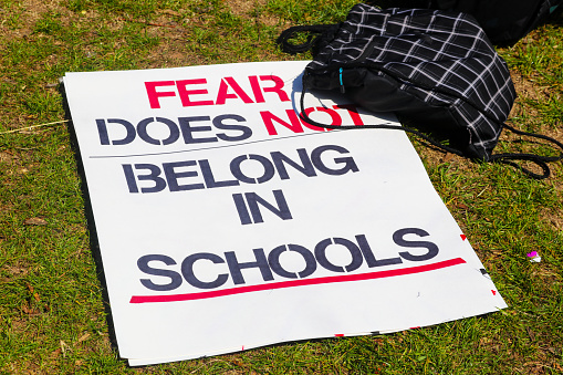 Backpack and sign on ground at March for Life protest